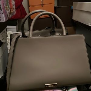 Carry and shoulder bag shape slight crease due to sitting not much wear.